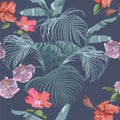 Exotic leaves of tropical plants with hibiscus flowers. Decorative composition on a dark blue background. Bright picture. Floral m